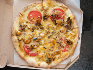 Seafood pizza as a background. Junk food.