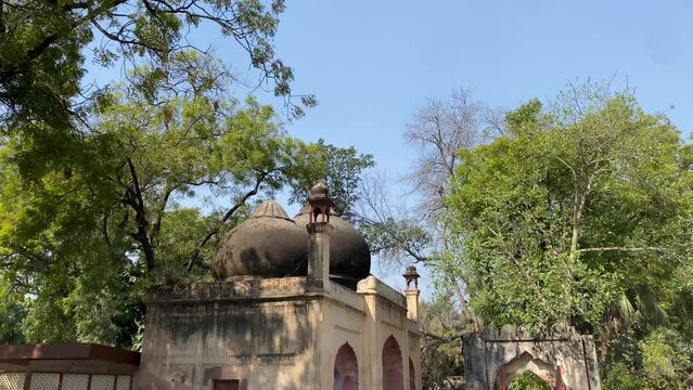 Panning shot of Alauddin Khilji's Tomb and Madrasa at the Qutb Complex in Delhi - India