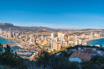 Skyscraper from the climb to the Peñón de Ifach Natural Park in the city of Calpe, Valencia, Valencian Community. Spain. Mediterranean sea. Cantal Roig Beach, La Fossa Beach and Las Salinas