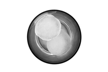Top view of a clear glass with two round ice cubes isolated on a white background