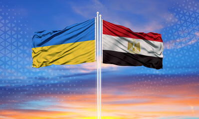 Ukraine and Egypt two flags on flagpoles and blue sky..