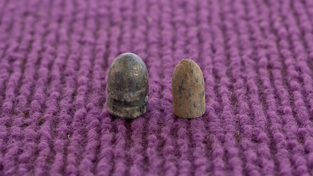 The 9mm and 11mm bullets are old and soiled.