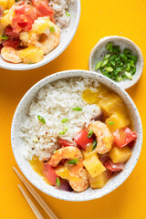 Pineapple Shrimp Curry With Rice In Bowl On Yellow Background Top View. Asian Cuisine Meal