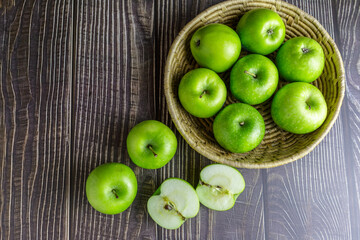 Green apples in a basket