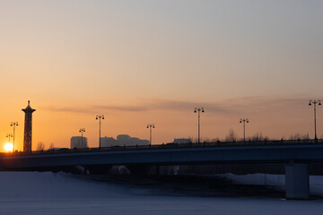 Fototapeta na wymiar Sunset over Maral bridge. Nur-sultan, Kazakhstan.