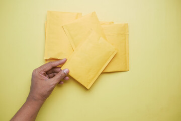  yellow paper bubble envelope on table 