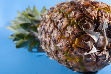 Pineapple on a blue background. close-up view