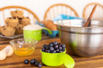 making blueberry muffens in a kitchen
