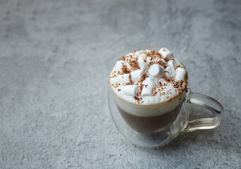 coffee with foam and marmalade on a gray background