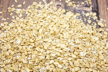 Oatmeal close-up. Natural oatmeal. Oat flakes bright light.