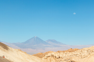 Valle de la Luna in Atacama desert withe Licancabour volcano in the background, Antofagasta, Chile,...