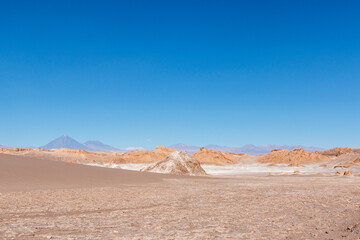 Valle de la Luna in Atacama desert withe Licancabour volcano in the background, Antofagasta, Chile,...