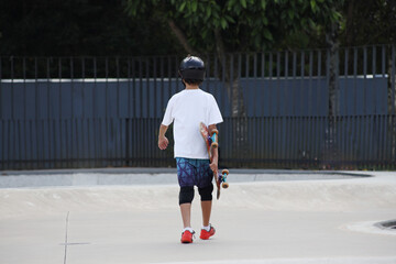 person walking on the street with skateboard