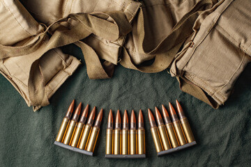 Military ammunition clips and bandoliers - obrazy, fototapety, plakaty
