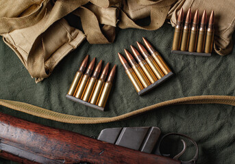 Military ammunition clips and bandoliers with rifle