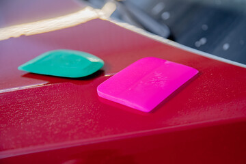 Master man installs vinyl film in risk zone of windshield to protect car body paint