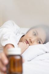 Obraz na płótnie Canvas Asian woman feeling sick have a headache, coughing because of Coronavirus Covid-19. Protection and recovery from the illness quarantine at home, Stay at home.