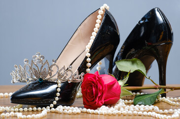 black patent leather women's shoes, pearls, diadem and rose
