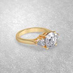 Obraz na płótnie Canvas 3 stone engagement ring laying down position in yellow gold 3D render