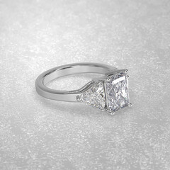 Obraz na płótnie Canvas 3 stone engagement ring laying down position in white gold 3D render