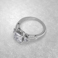 Obraz na płótnie Canvas 3 stone engagement ring laying down position in white gold 3D render