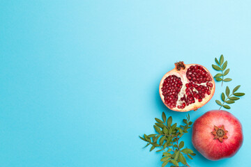 Fresh juicy pomegranate on color background, top view