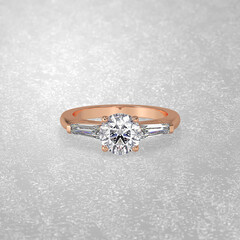 3 stone engagement ring laying down position in rose gold 3D render