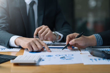 Team of business people working together discussion and analysis data chart and graph, finance and accounting at meeting.
