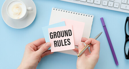 Ground Rules text on sticky notes isolated on office desk