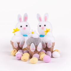 Easter bunnies and candy eggs concept isolated