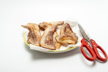 Rashers of bacon, grilled at the table and dipped in a mixture of sesame oil and salt.