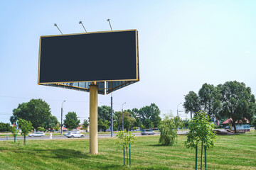 Blank billboard mockup with white screen. Against the backdrop of nature and blue sky. Business concept. Copy space banner for advertising.