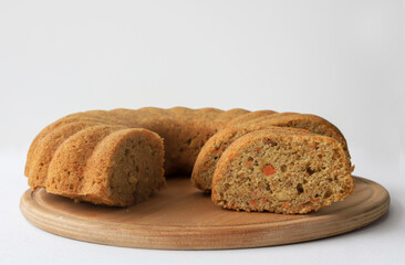 Homemade orange cake in a beautiful yellow cake holder. 