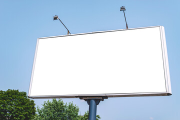 Blank billboard mockup with white screen. Against the backdrop of nature and blue sky. Business concept. Copy space banner for advertising.