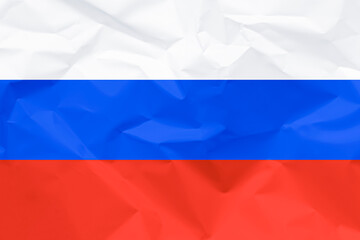  Flag of Russia on a crumpled paper texture, as a symbol of the imposed sanctions, the economic crisis