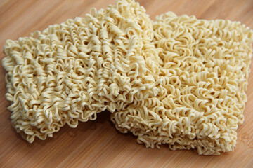 instant pasta close-up on a wooden table, fast food
