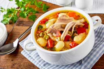 white bean soup with pork meat  in a bowl