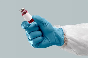 Doctor holding medical vaccine vial