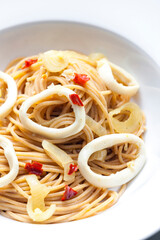 spaghetti with calamari, chilli pepper and onion