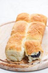 traditional Czech  poppy stuffed buns on wooden board