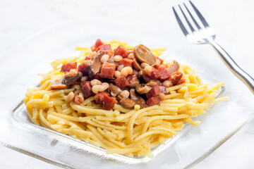 spatzles with bacon, beans and mushroom sauce