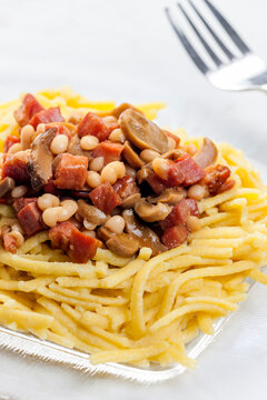 spatzles with bacon, beans and mushroom sauce