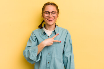 young pretty woman feeling happy, positive and successful, with hand making v shape over chest,...