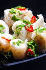marinated sepia with parsley and chilli pepper filled with rice