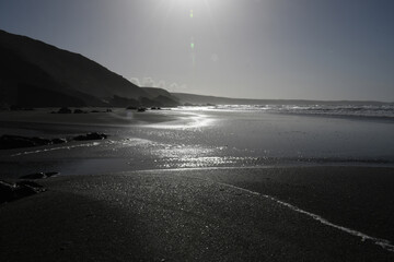 Backlit Tregardock Beach Cornwall