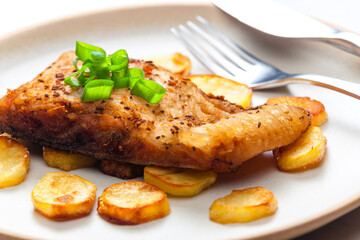 carp on cumin with fried potatoes