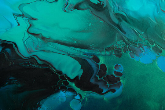 Fluid Art. Metallic Green And Blue Abstract Waves With Golden Particles On Black Background. Marble Effect Background Or Texture