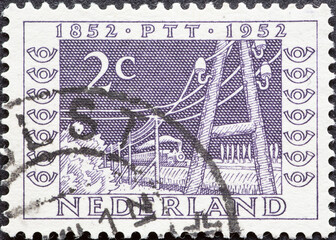 Netherlands - circa 1952: a postage stamp from the Netherlands , showing a Telegraph Lines and...