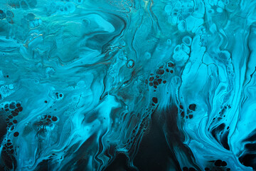 Fluid Art. Blue abstract wave swirls on black background. Marble effect background or texture