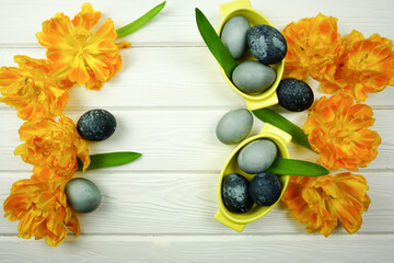 Easter flatley with painted eggs and tulips
